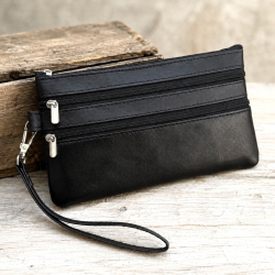 Lovisa clutch med håndledsrem - Blød sort lammeskind