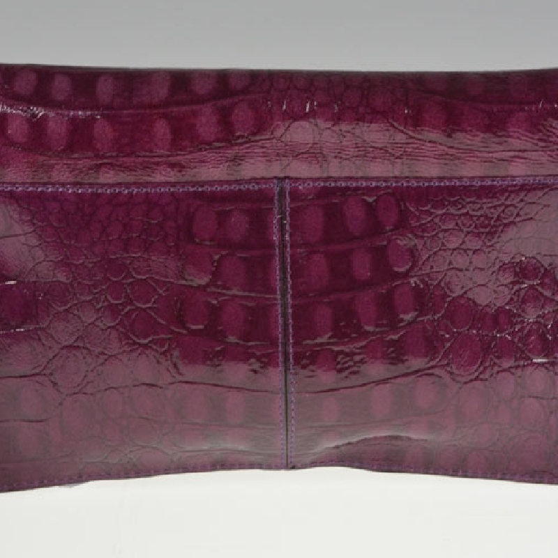 Elegant clutch Partridge i croco präglat skinn med rem